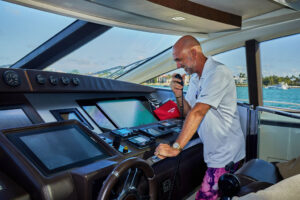 an old man in a control room of a yacht